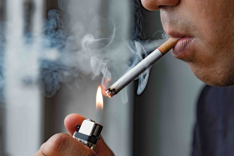 Man smoking a cigarette - NU Hospitals